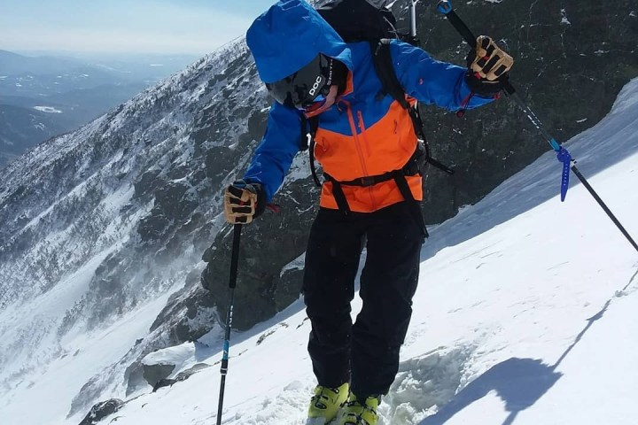 a man skiing down a snow covered mountain