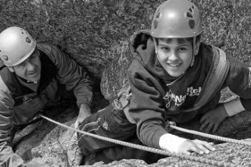 a little boy wearing a helmet