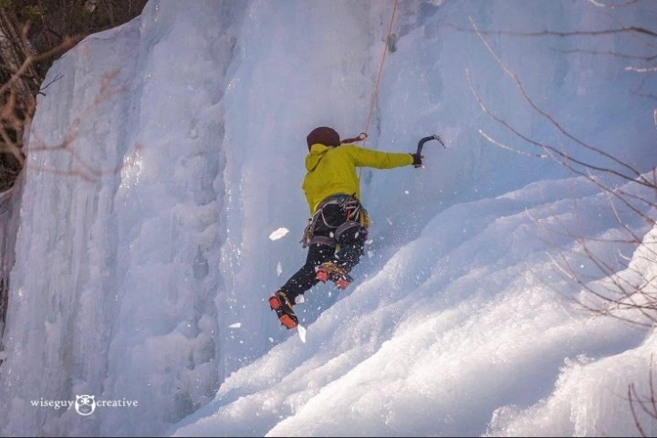 a man riding climbing an icy slope