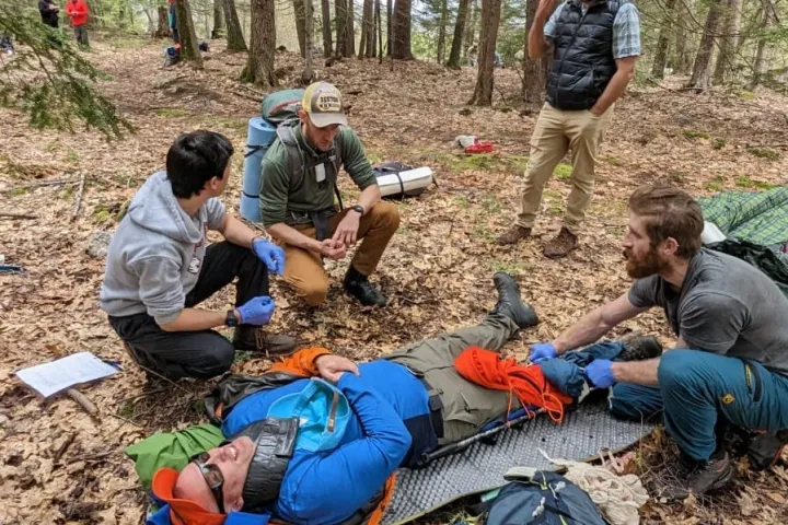 a group of people sitting at a park