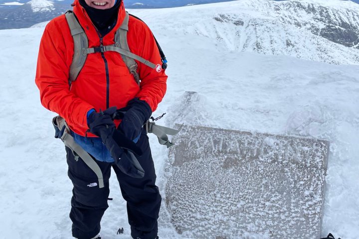 a man that is standing in the snow