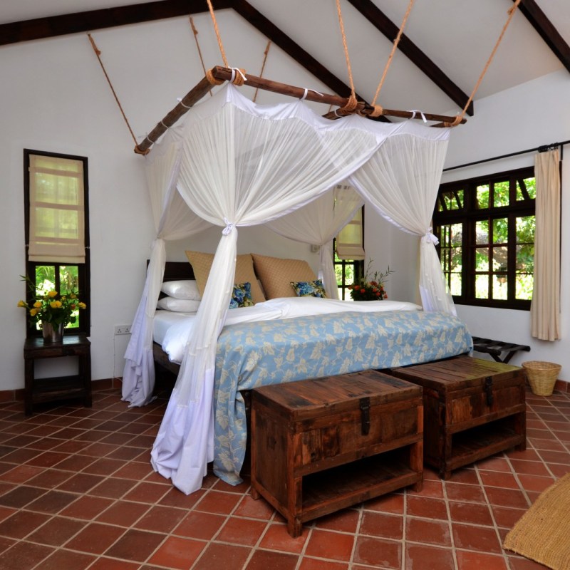 a bedroom with a tile floor