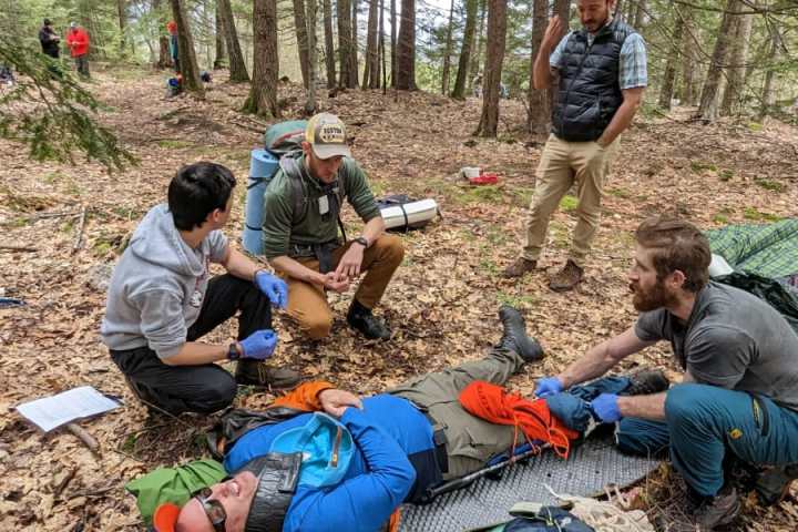 a group of people sitting at a park